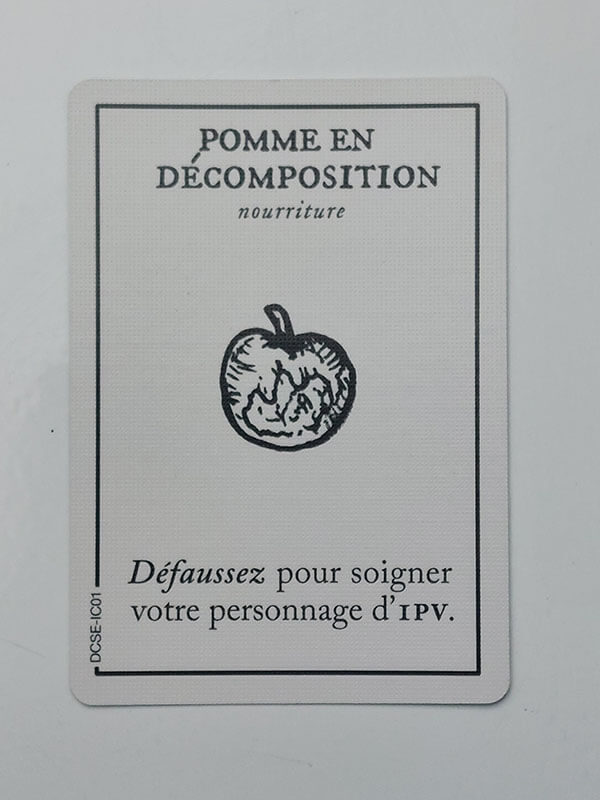 une carte de jeu montrant une pomme et un texte de description